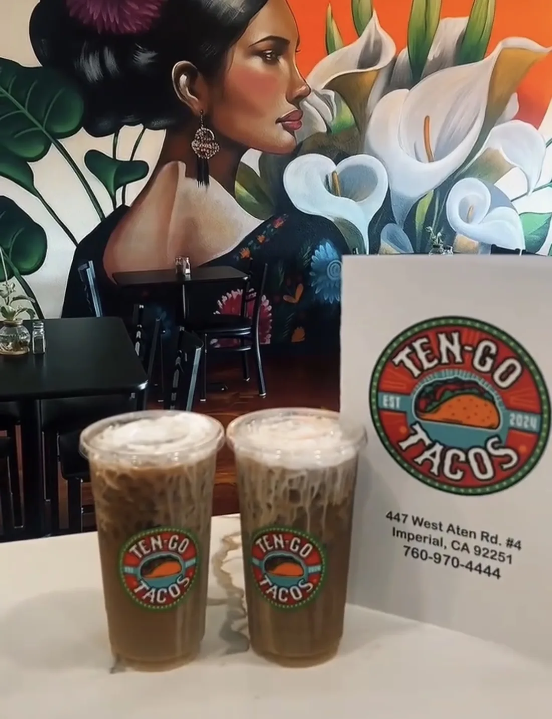 Iced café de olla at Ten-Go Tacos in front of the mural